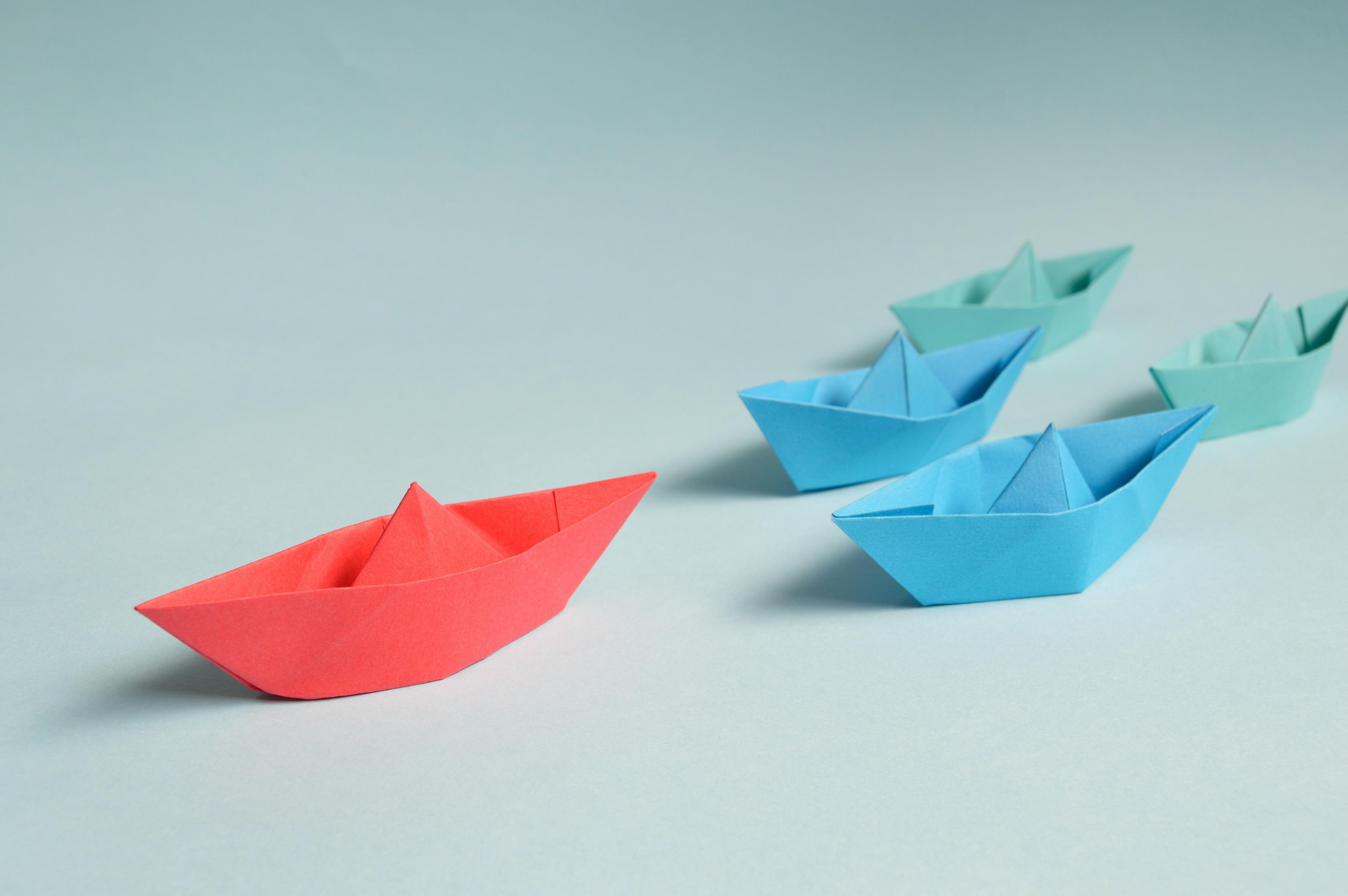 paper boats in a v formation